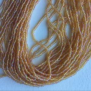 Hank of seed beads size 11/0 golden rainbow glass